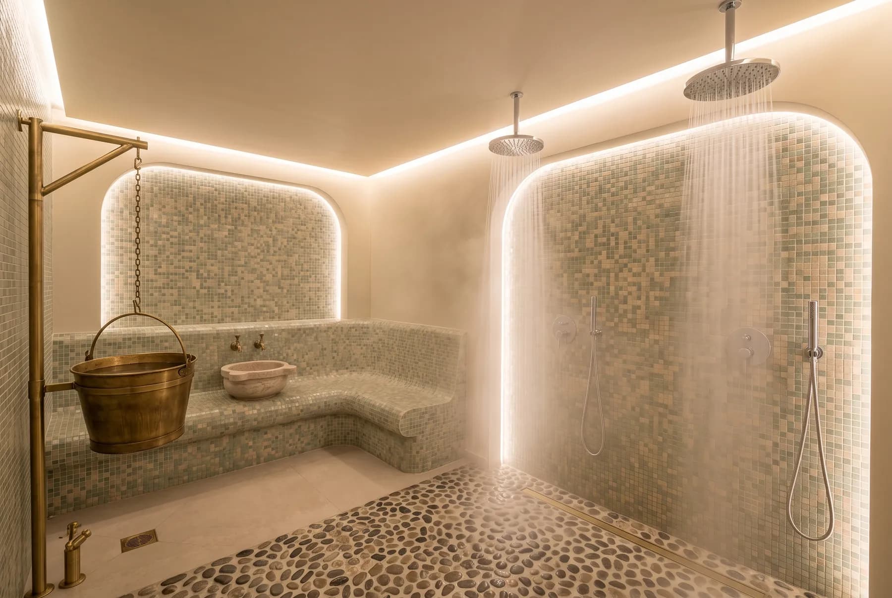 Mosaic experience showers with rain heads and a bucket shower