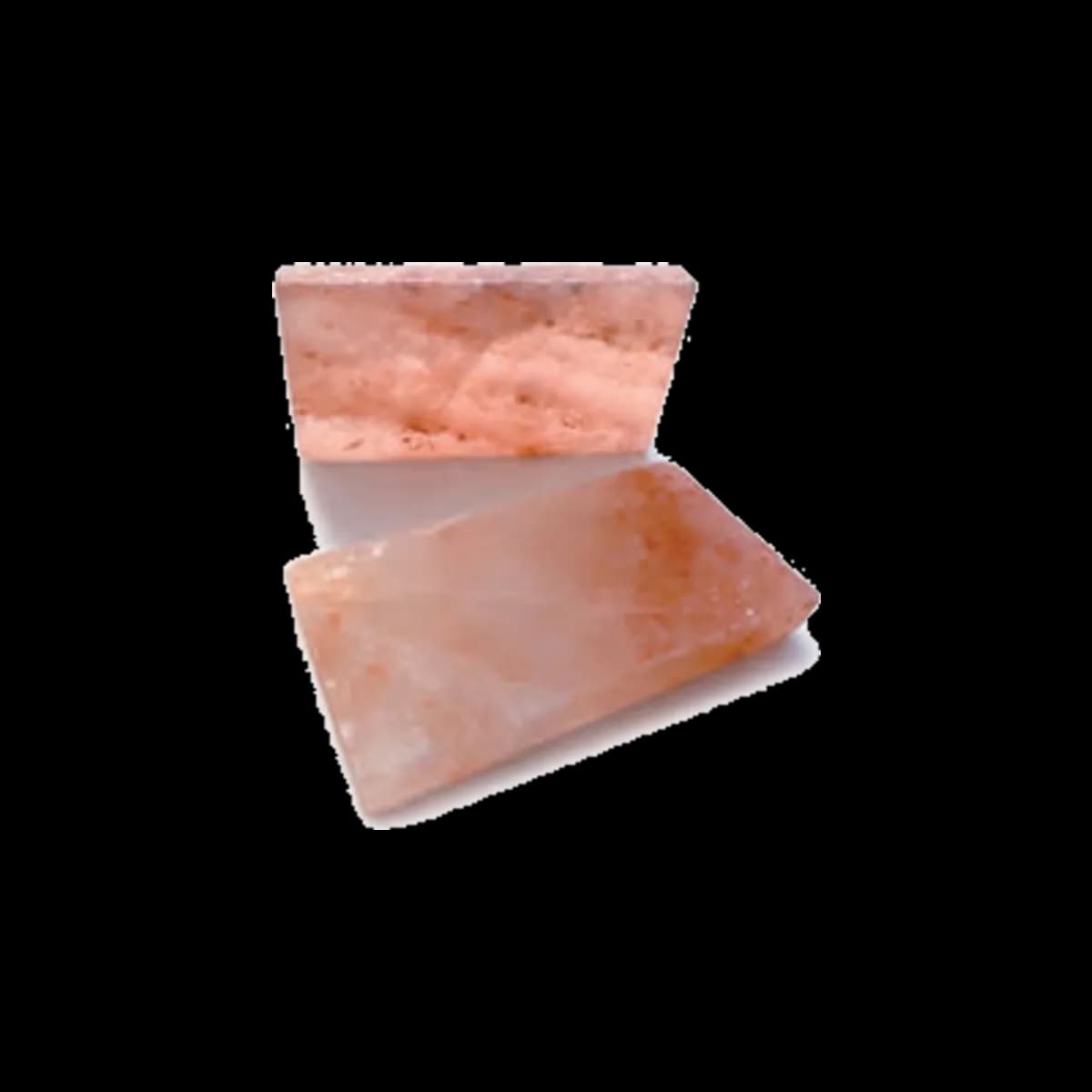 Two Himalayan salt bricks, pink-toned and veined, one standing upright and one lying flat
